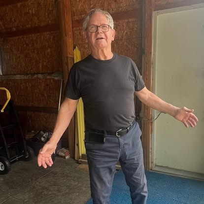 Megan's grandpa in the barn where Flawless Finish Co. began
