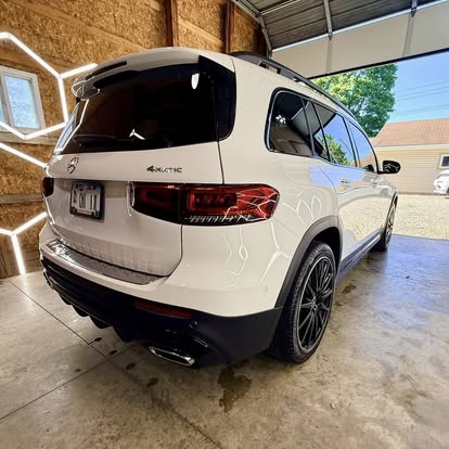White Mercedes-Benz GLB detailed under the hex lights