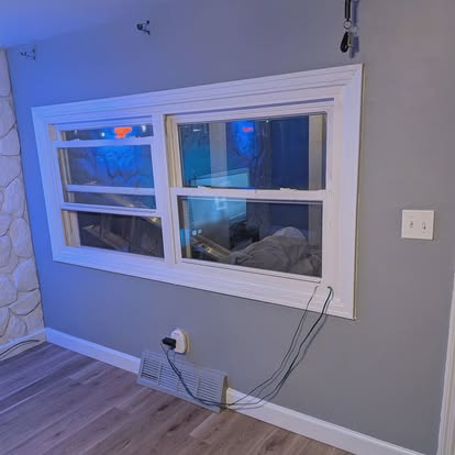 Finished room with accent wall and new floor