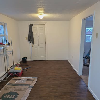 Hallway with fresh flooring and recessed lighting