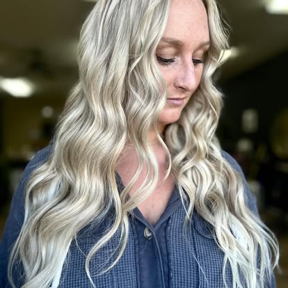 Long, icy platinum blonde with soft beach waves styled at Turning Heads