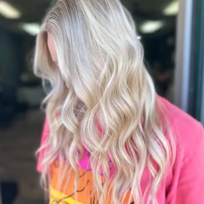 Sun-kissed honey blonde with loose beach waves