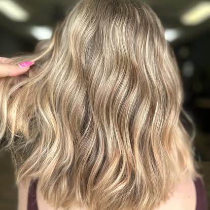 Cool, buttery blonde lob with soft waves